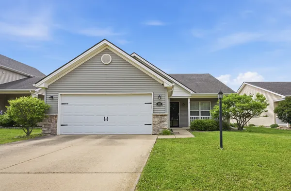 a view of a house with a yard