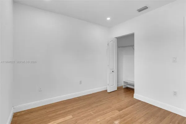 a bathroom with a toilet sink shower and mirror