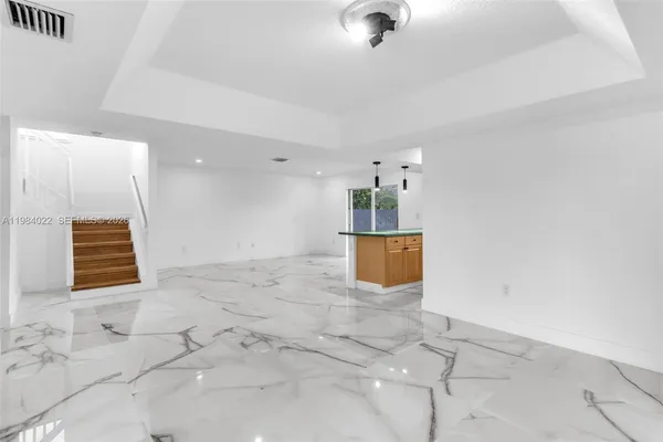 a kitchen with stainless steel appliances granite countertop a sink and cabinets