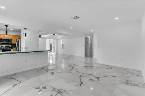 a living room with granite countertop furniture and a fireplace