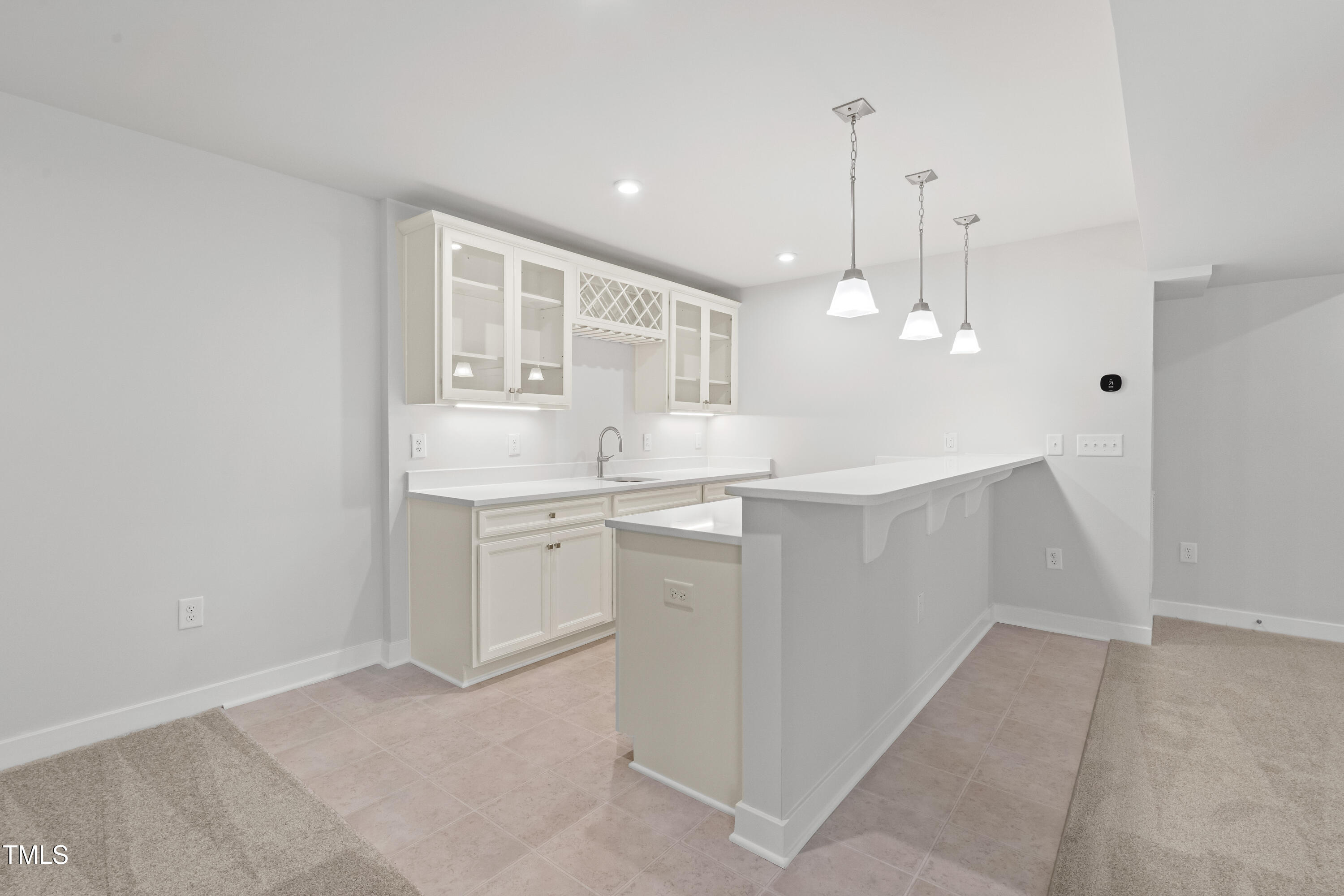 573 Freedom Trail Drive Willow Spring, NC 27592 - Photo 29 of 37 a kitchen with white cabinets and sink