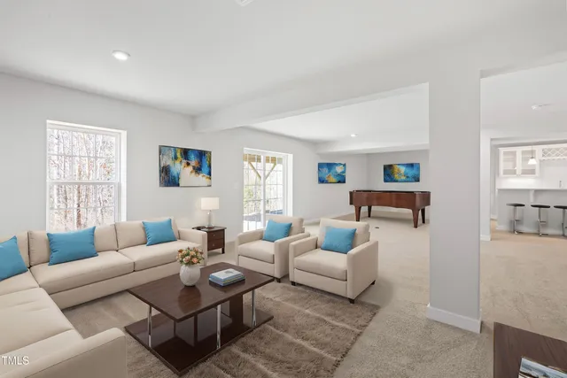 a living room with furniture and a window