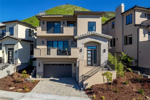 a front view of a house with yard