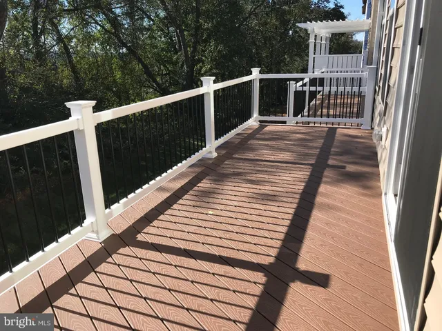 a balcony with wooden floor