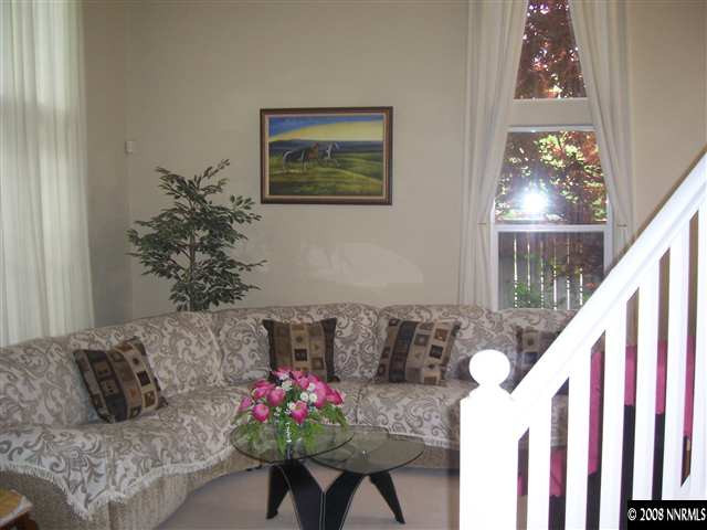4890 West Creek Ridge Trail Reno, NV 89519 - Photo 7 of 9 a living room with furniture and flowers