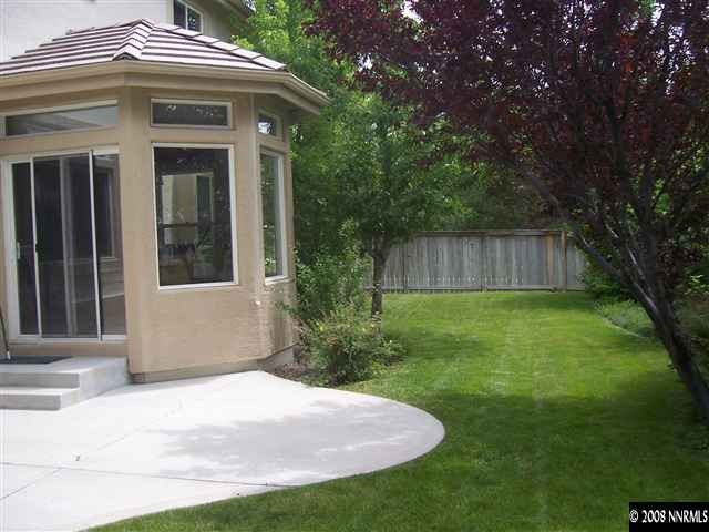 4890 West Creek Ridge Trail Reno, NV 89519 - Photo 9 of 9 a front view of a house with a yard
