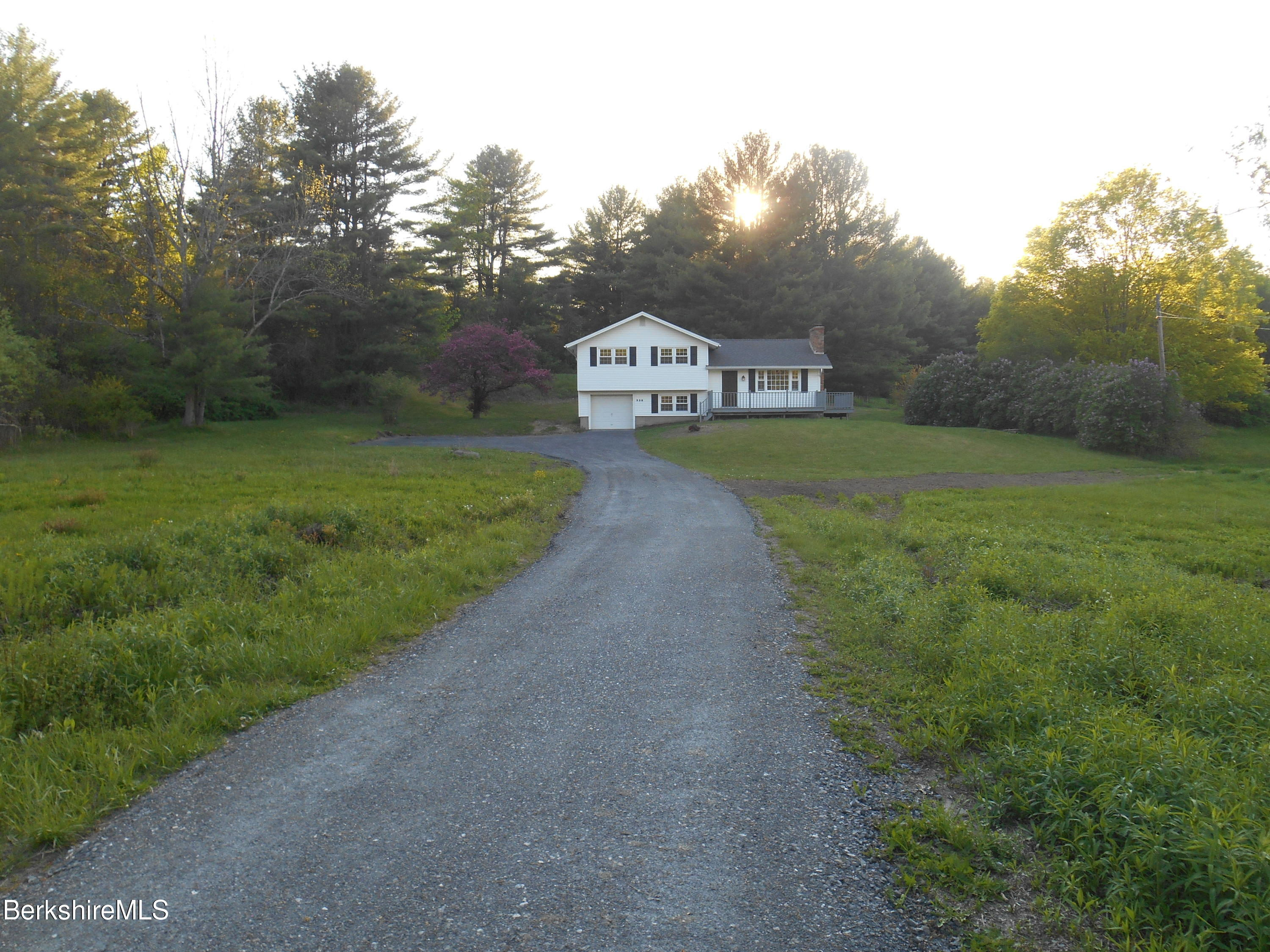 238 Swamp Road Richmond, MA 01201 - Photo 2 of 21 a view of a house with a big yard next to a road
