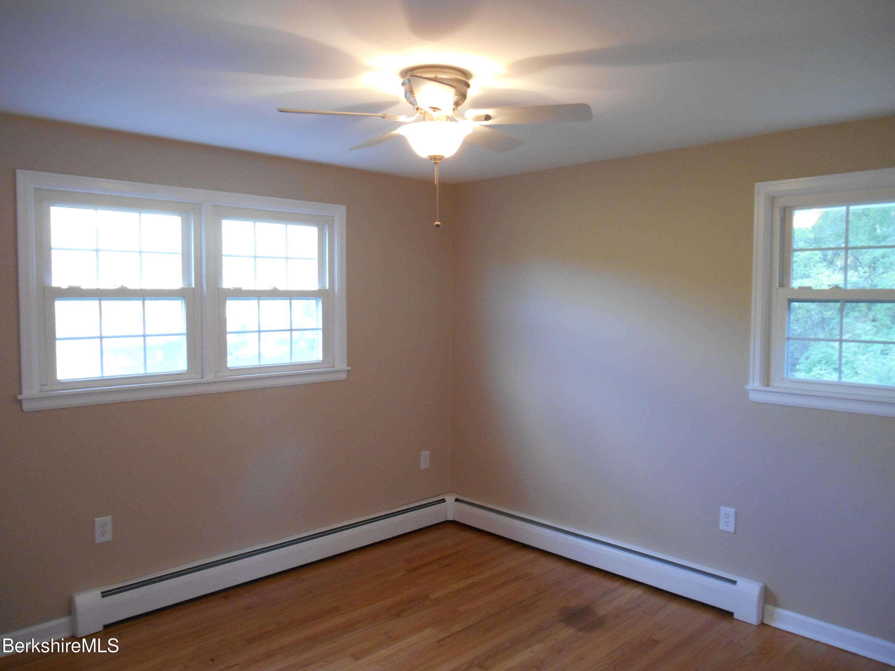 238 Swamp Road Richmond, MA 01201 - Photo 14 of 21 a view of an empty room with window and wooden floor