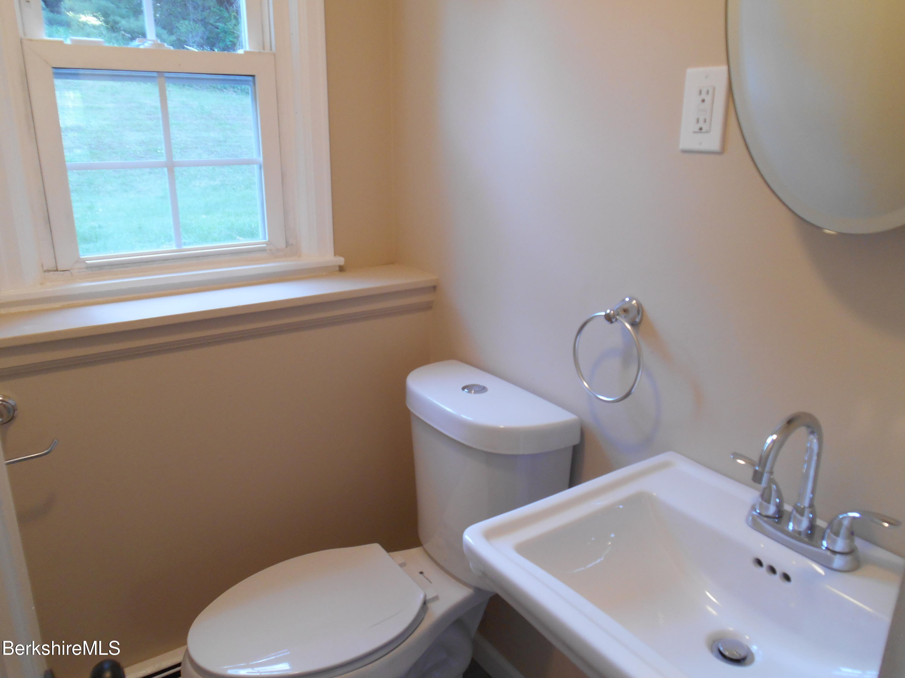 238 Swamp Road Richmond, MA 01201 - Photo 17 of 21 a bathroom with a sink a toilet and a window