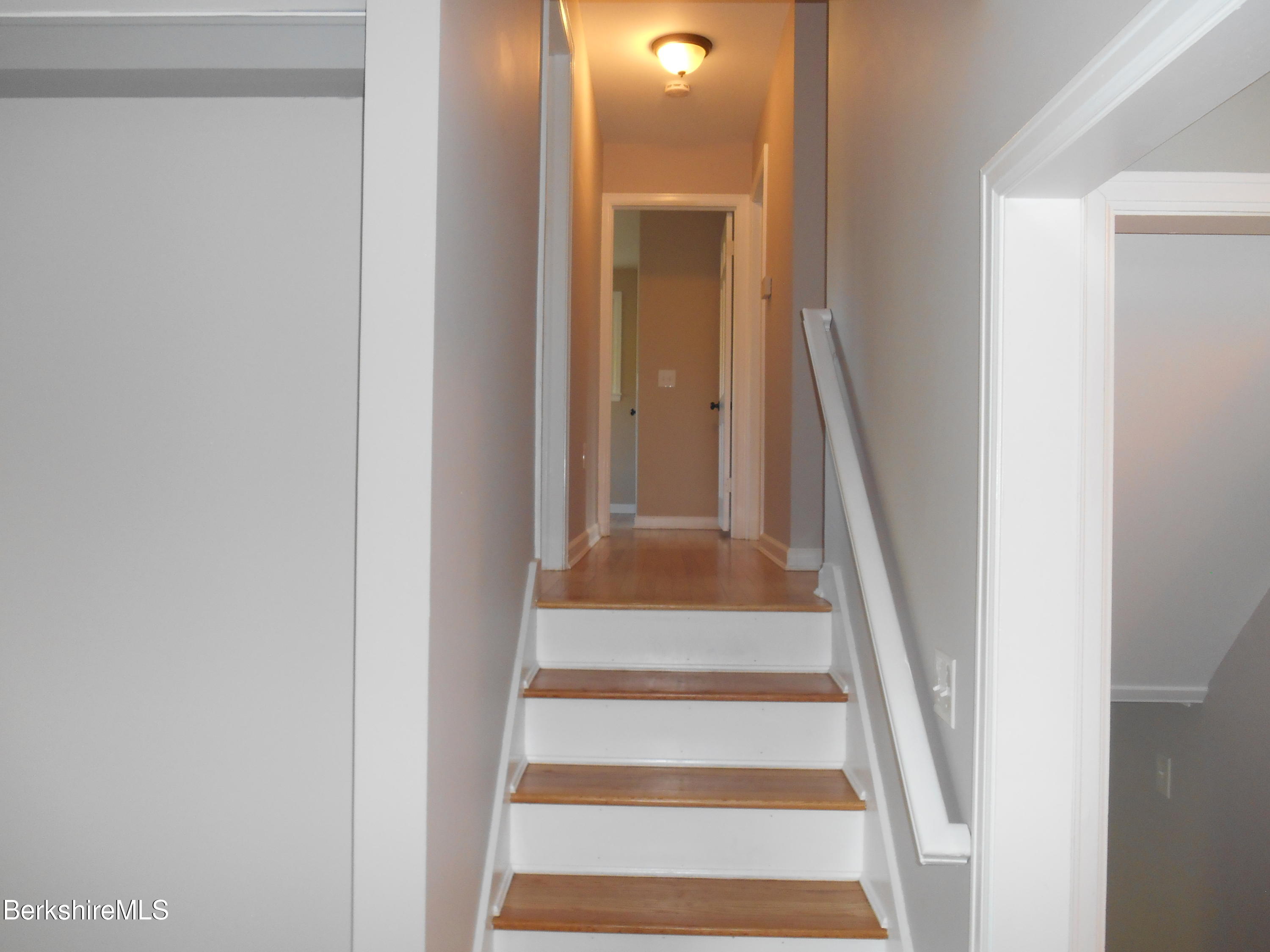 238 Swamp Road Richmond, MA 01201 - Photo 10 of 21 a view of staircase with white walls and a window
