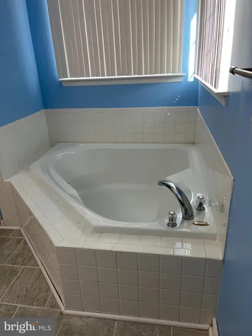a bathroom with a bathtub