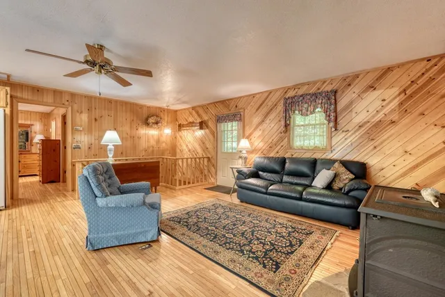 a living room with furniture and a rug