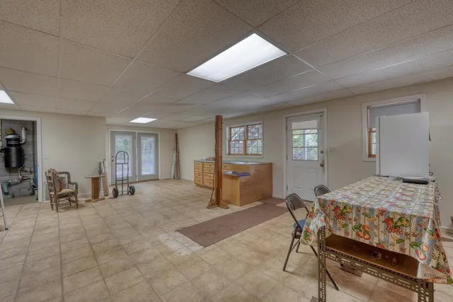 a bedroom with furniture and windows