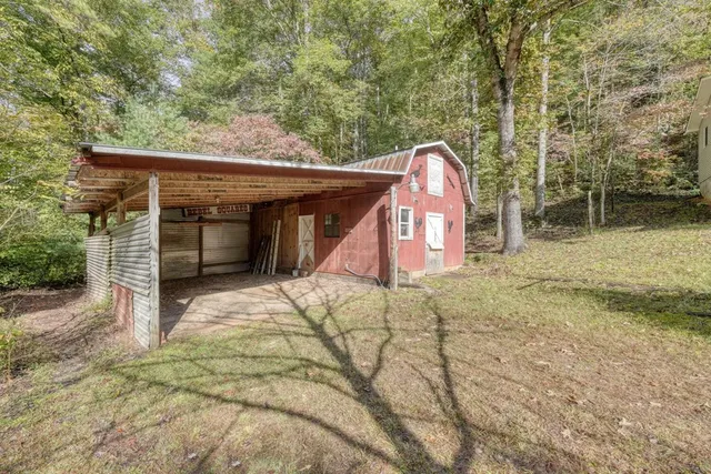 a living room with furniture pool table and a wooden floor