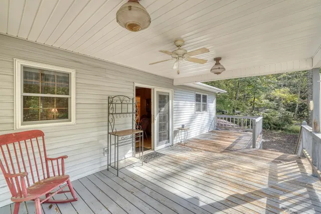 a view of a house with a backyard
