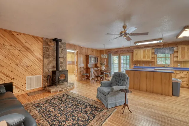 a living room with furniture and a rug
