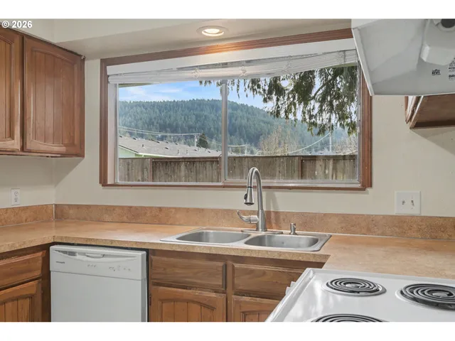 a kitchen with a stove and a microwave