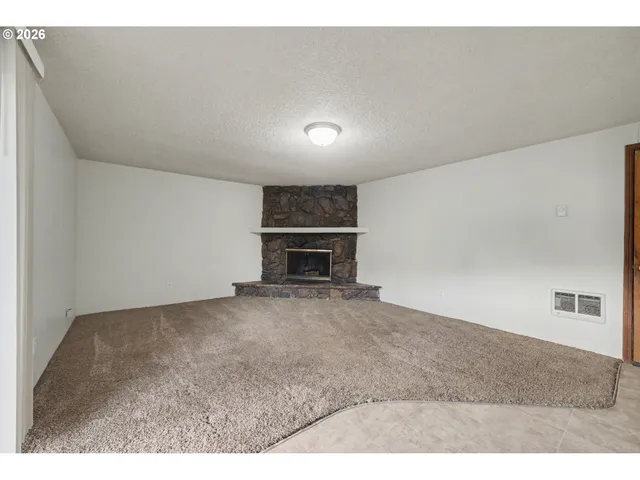 a living room with a fireplace