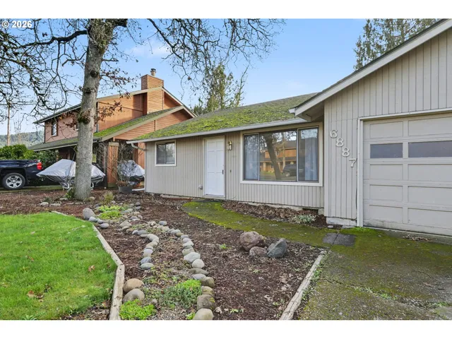 a house view with a backyard space