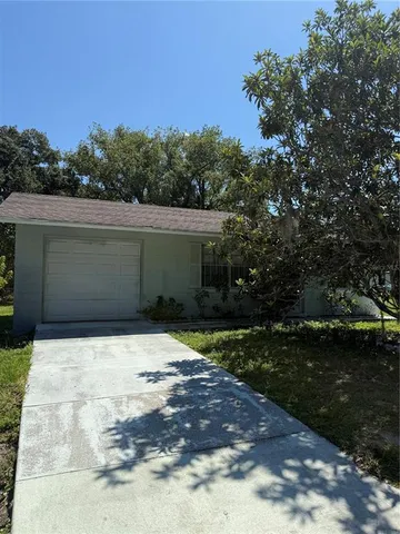 a view of backyard with green space