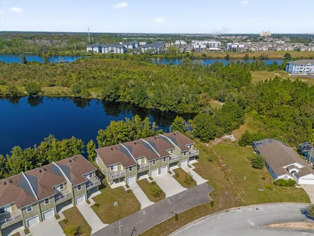 an aerial view of residential houses with outdoor space