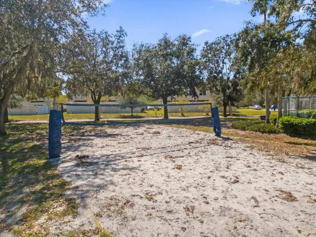 a view of a playground with basketball court