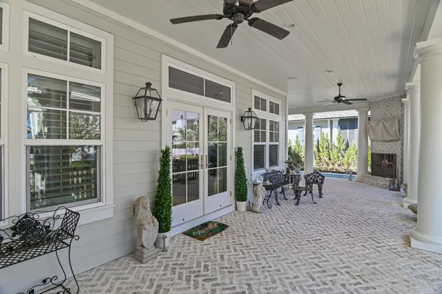 a dining room with furniture and a window