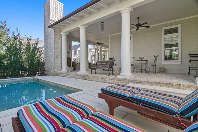 a view of swimming pool with outdoor seating