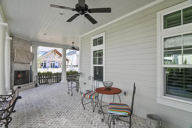 a view of a patio with a table and chairs