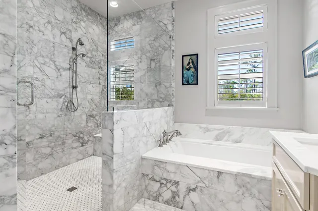 a bath tub sitting next to a white sink