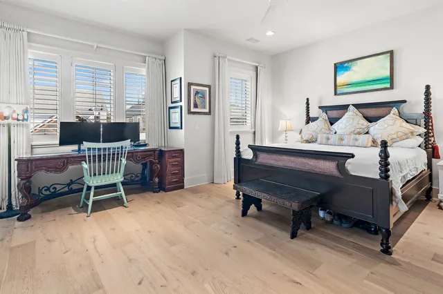 a bedroom with furniture and a window