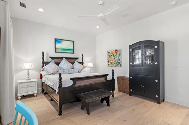 a bed room with a bed and a television