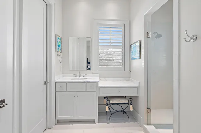a bathroom with a sink double vanity and a mirror