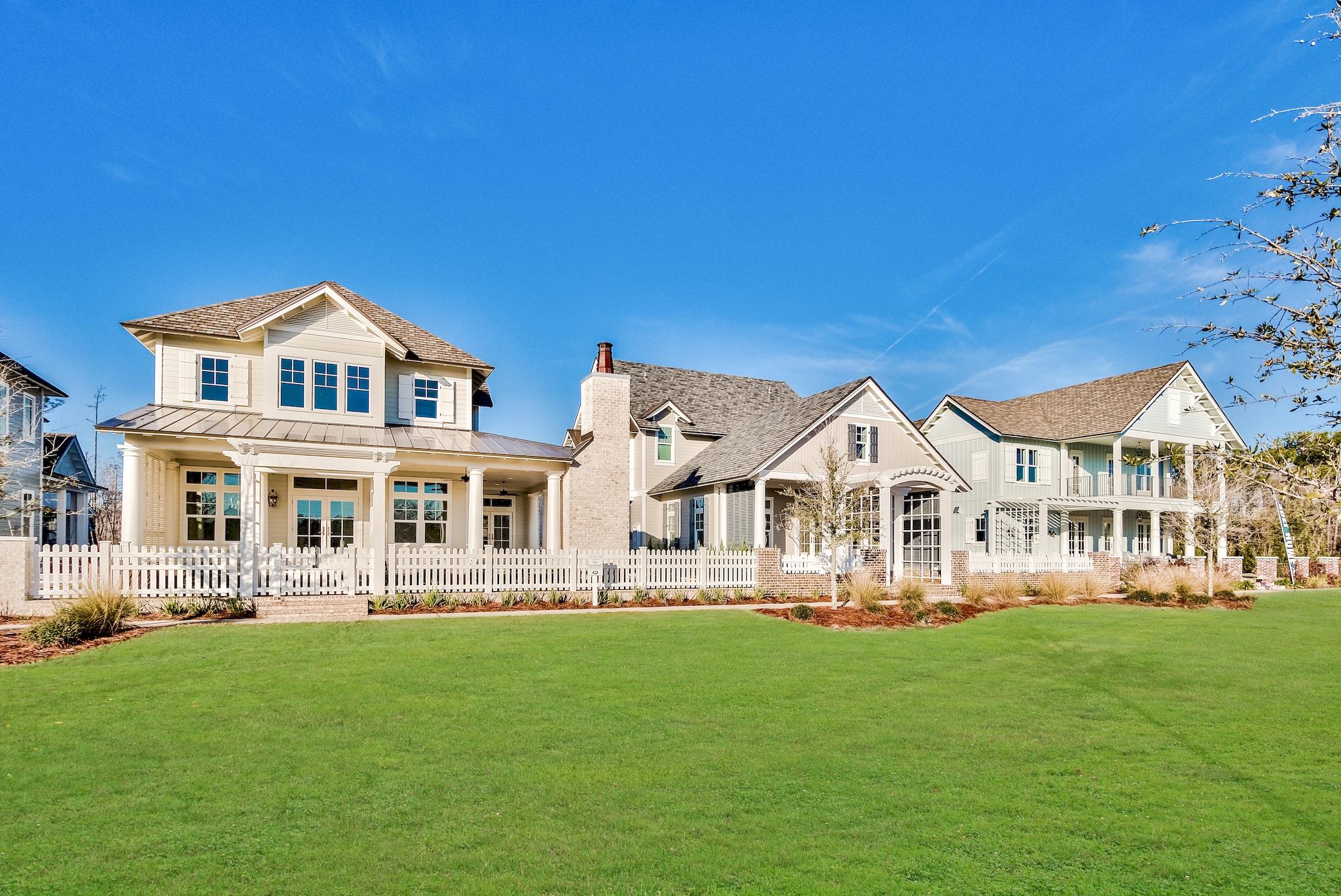 259 Moonlit Way Destin, FL 32541 - Photo 47 of 51 a front view of a house with a yard table and chairs