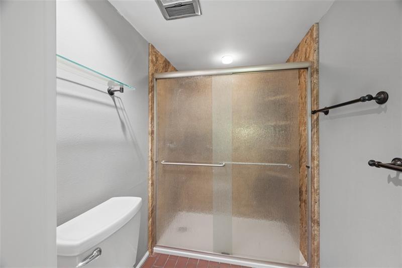 5 Bayard Road, Unit 219 Pittsburgh, PA 15213 - Photo 15 of 26 Enjoy an updated bathroom with a large step-in shower, combining modern design with functional space for everyday comfort.