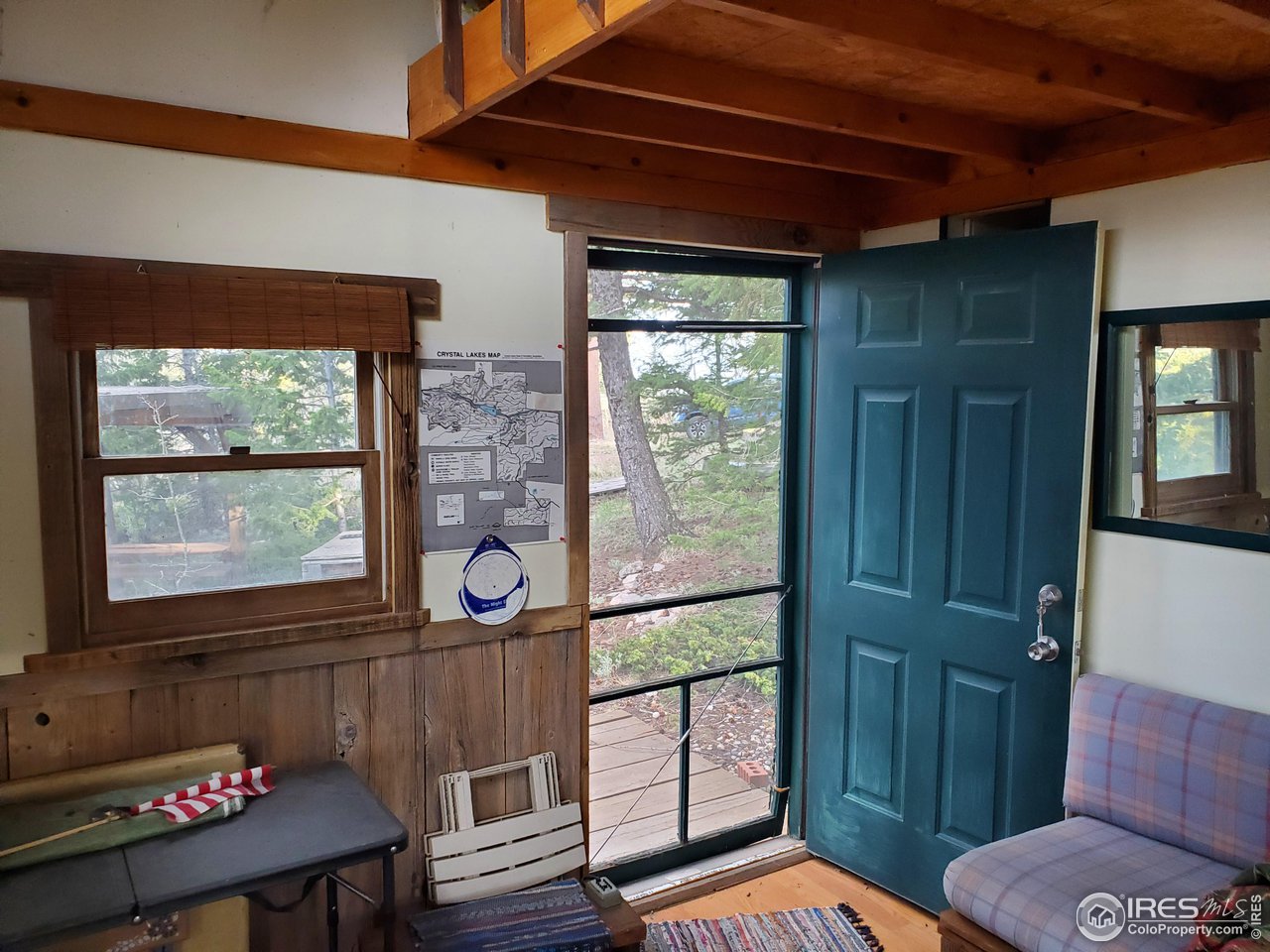 1375 Crow Road Red Feather Lakes, CO 80545 - Photo 15 of 17 a living room with furniture and a window
