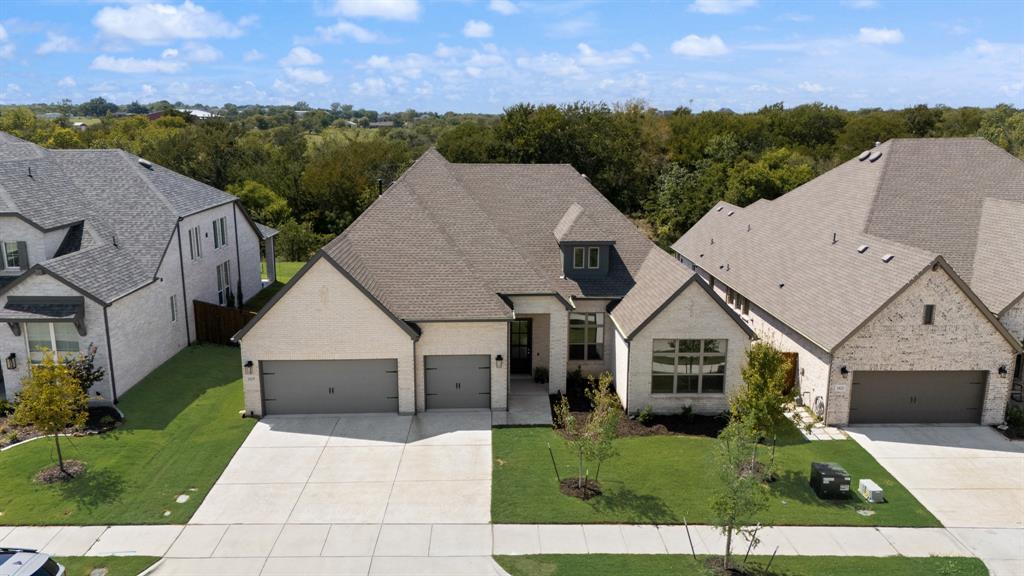 a aerial view of a house in a big yard