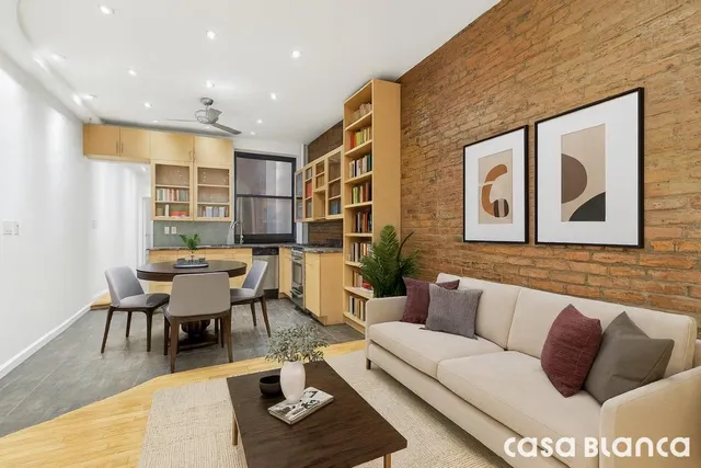 a living room with furniture and a rug