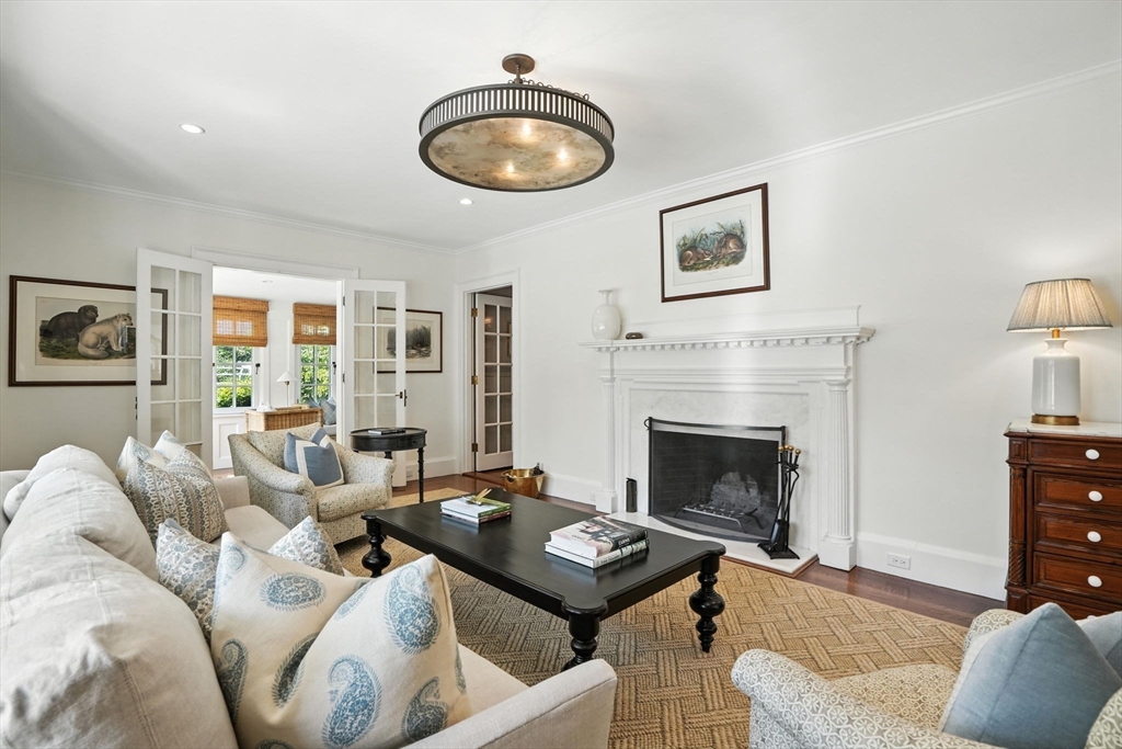 15 Winthrop Road Lexington, MA 02421 - Photo 5 of 39 a living room with furniture and a fireplace