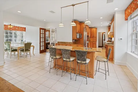 a dining room filled with furniture and window