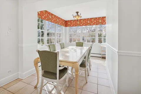 a view of a livingroom with furniture and a large window
