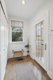 a dining room with a table and chairs