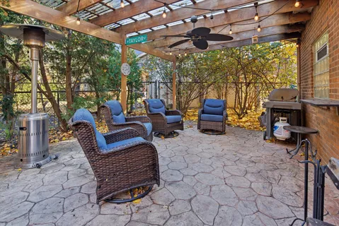 a view of a livingroom with furniture and staircase