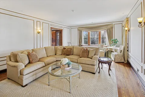 a living room with furniture a fireplace and a fireplace