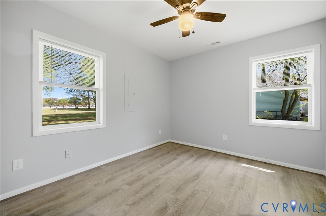 1914 Moger Drive Hampton, VA 23663 - Photo 5 of 15 a view of an empty room with a window and a ceiling fan