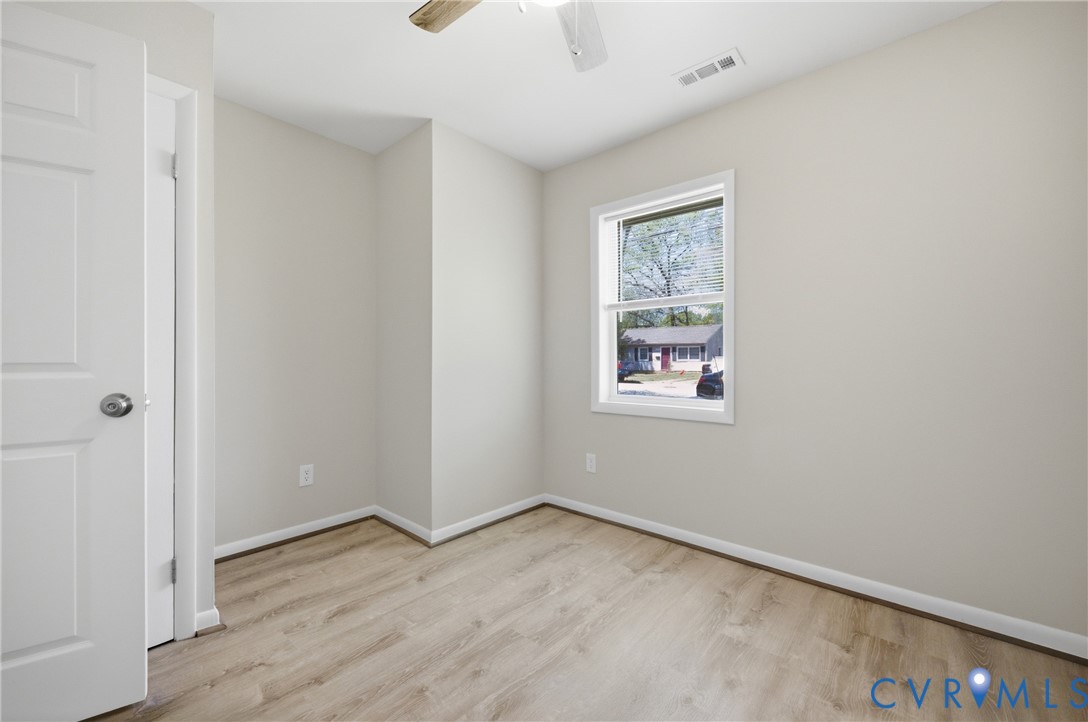 1914 Moger Drive Hampton, VA 23663 - Photo 9 of 15 an empty room with wooden floor and windows