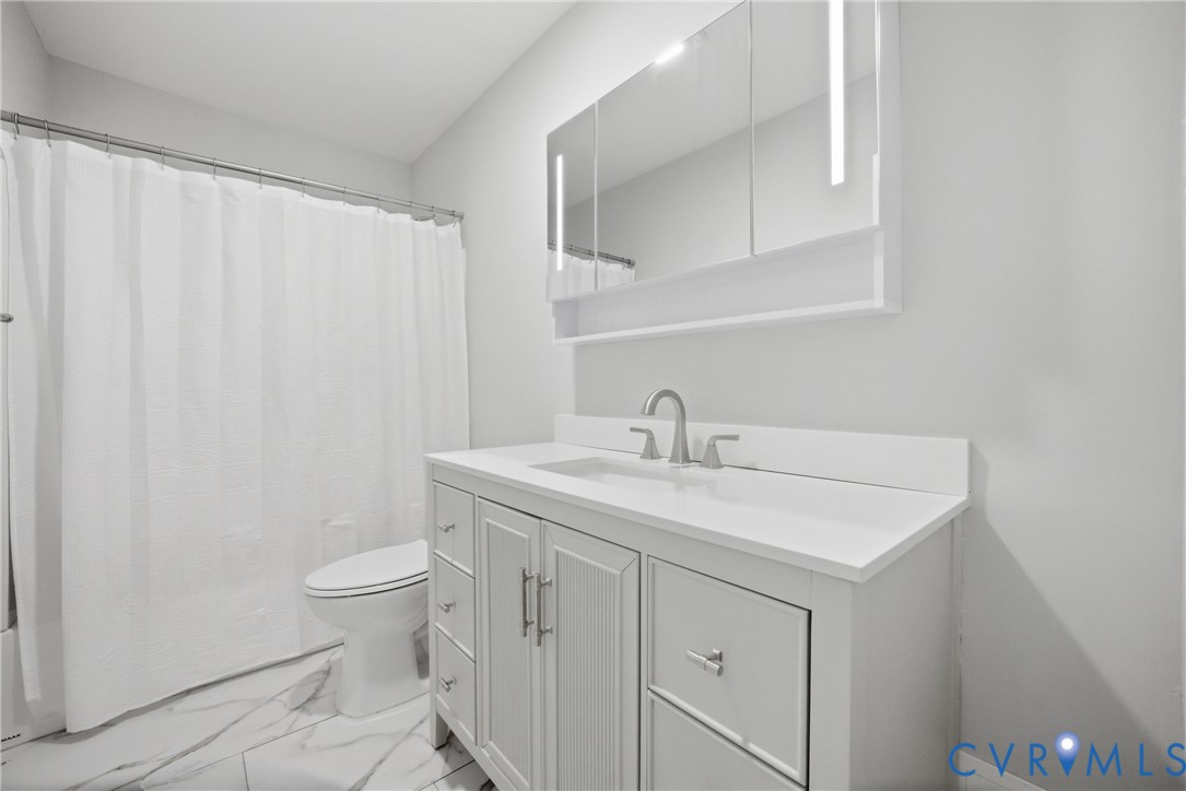 1914 Moger Drive Hampton, VA 23663 - Photo 10 of 15 a bathroom with a sink toilet and vanity