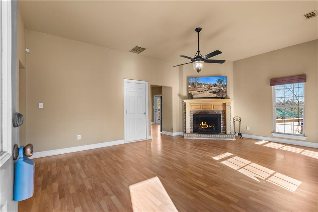 200 Bradley Road Jackson, GA 30233 - Photo 6 of 6 a view of an empty room with a fireplace and a window