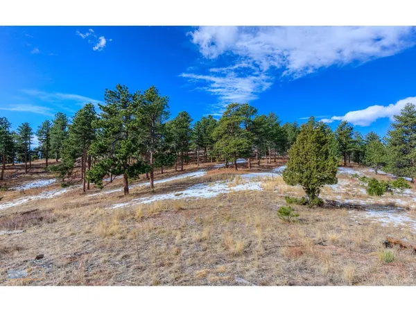 a view of a lake with beach and city view