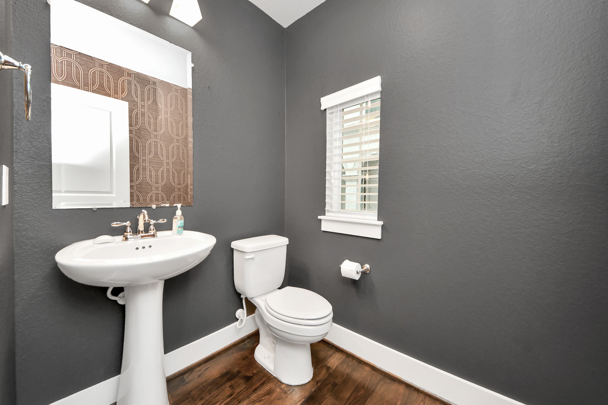 2704 Freund Street Houston, TX 77003 - Photo 21 of 45 a bathroom with a sink toilet and a mirror